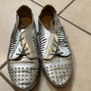 Rue 21 silver tie up flats.